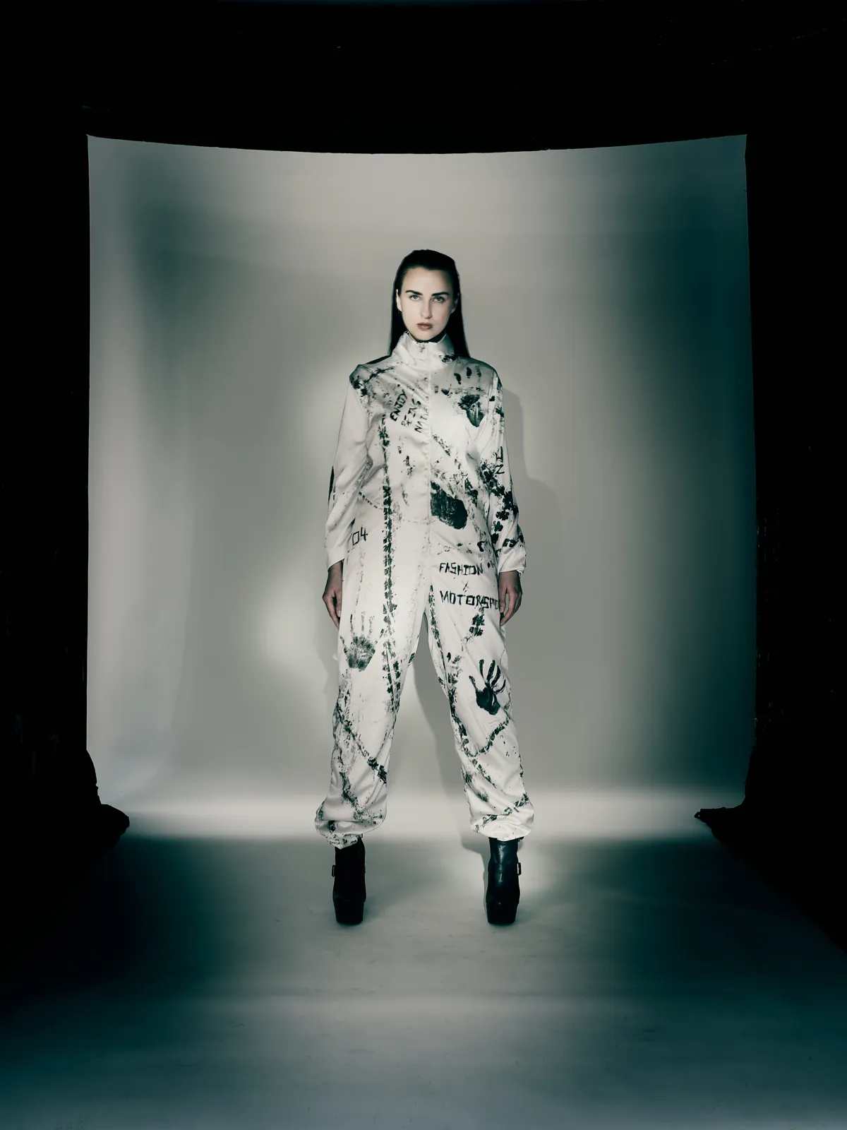 Model on the runway wearing the Driven by Instinct tyre-track jumpsuit
