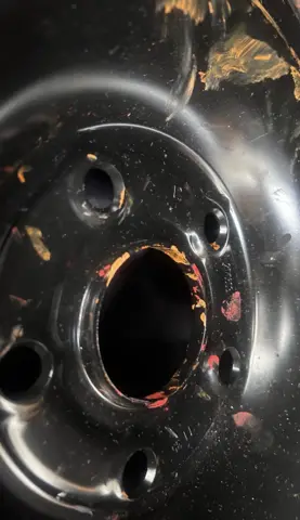 Black tyre wheel photographed head-on