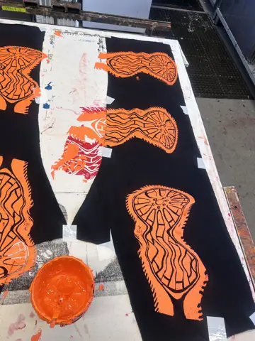 Screen loaded with orange ink