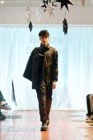 Model walking the runway in the WorkWear look